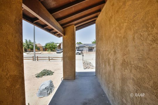 429 Debra Lane Ridgecrest, CA 93555 - Photo 34 of 34 a view of a porch with a table and chairs