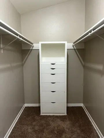 an empty closet with white paint