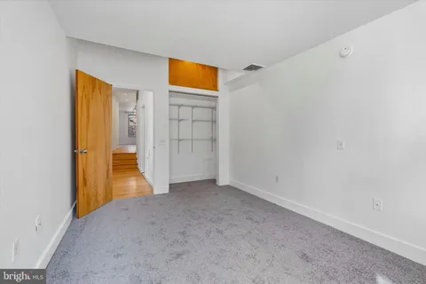 a view of empty room with a bathroom