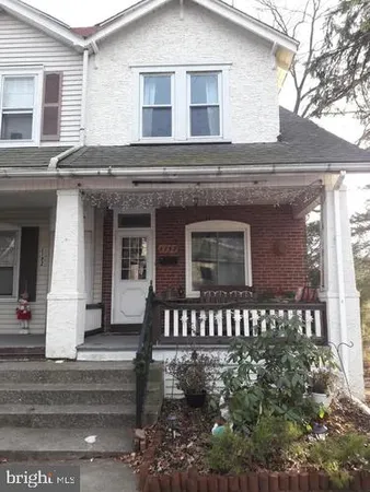 a view of a house with a bench