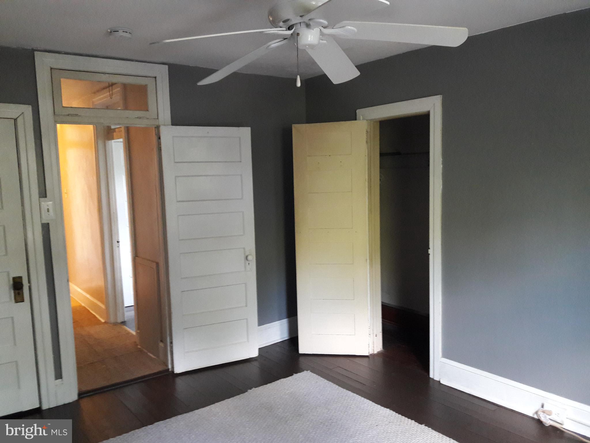 1150 Queen Street Pottstown, PA 19464 - Photo 21 of 31 an empty room with wooden floor closet and windows
