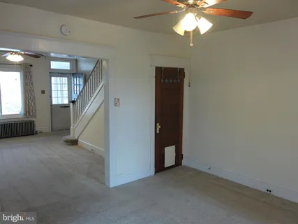 a view of a kitchen with a sink and a chandelier
