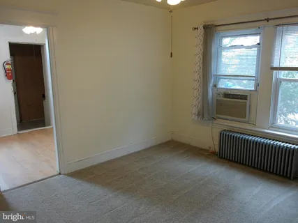 a utility room with dryer washer and a window