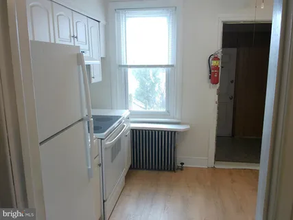 a view of cabinets and window