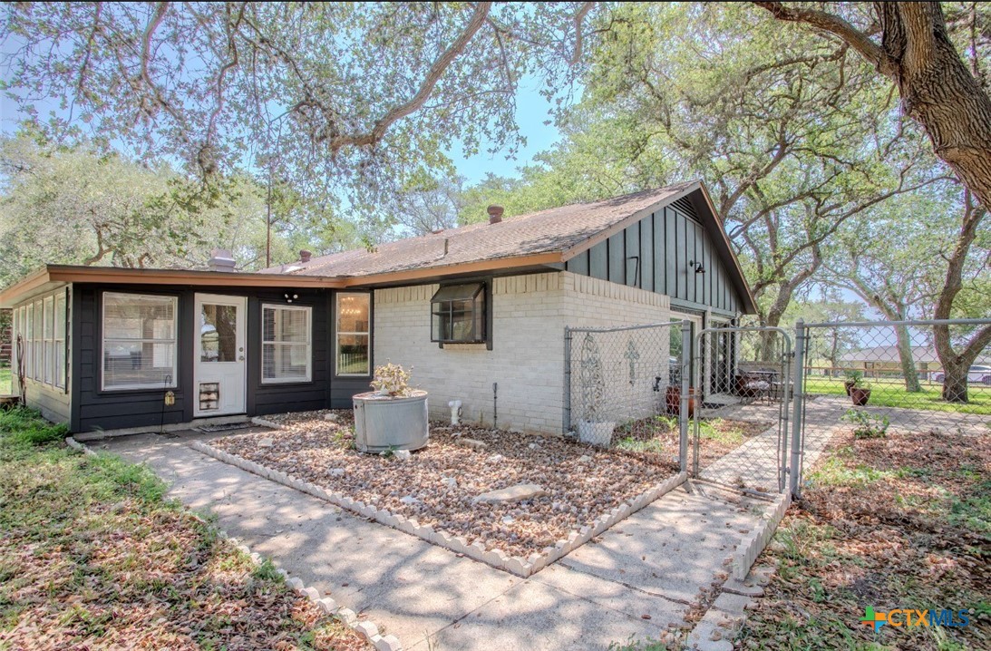 188 Cavalry Road Victoria, TX 77905 - Photo 20 of 30 a view of a house with a yard and large tree