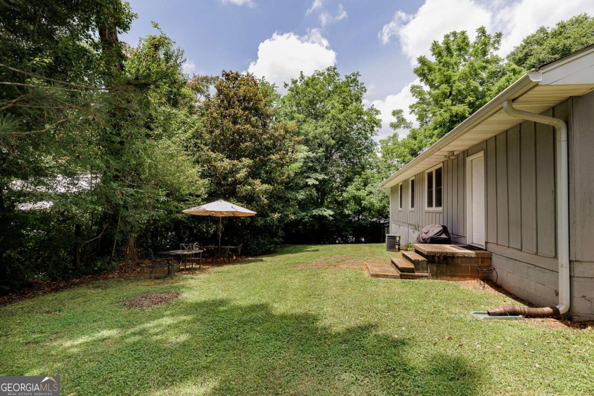 168 Pearl Street Athens, GA 30601 - Photo 29 of 43 a swimming pool with outdoor seating and yard