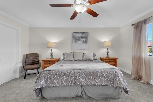 a bedroom with a bed and lamp