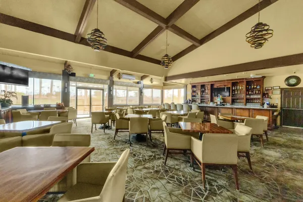 a living room with lots of furniture and a table