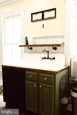 a bathroom with a sink and mirror