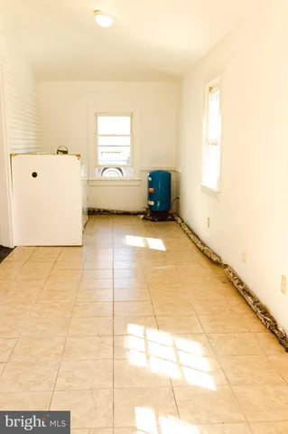a bathroom with a toilet and a mirror
