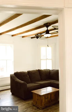 a living room with a couch and a window