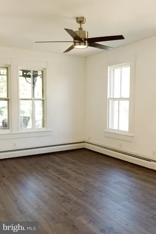 a picture of a bench in front of a window