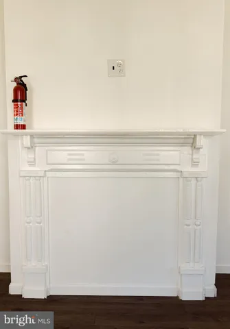 a bathroom with a granite countertop sink a mirror and a bathtub