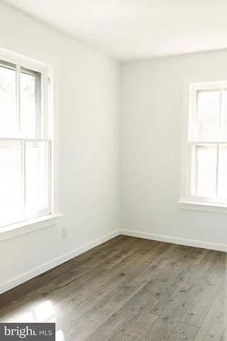 a bathroom with a toilet a sink and a window