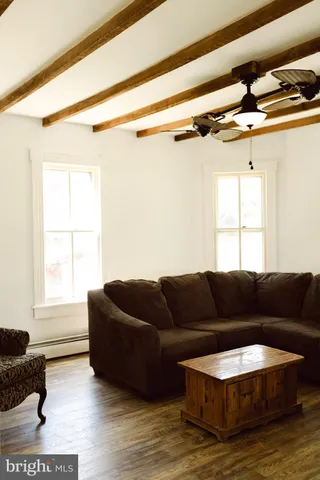 a living room with furniture and a window