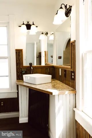 a green field with flowers in it