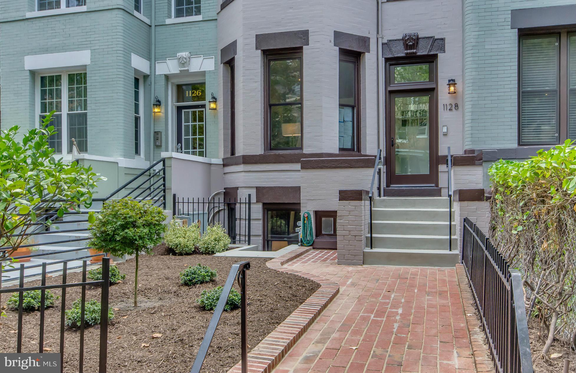 1128 Columbia Road Northwest Washington, DC 20009 - Photo 2 of 26 a view of a house with a porch