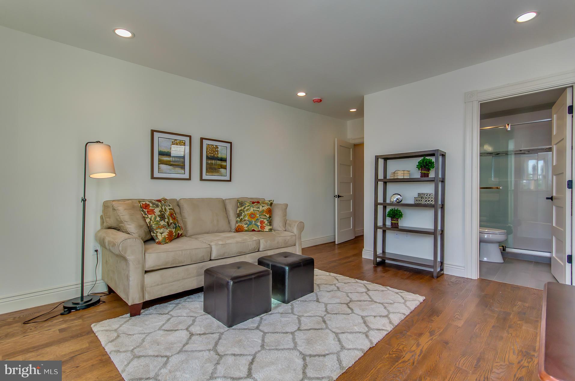 1128 Columbia Road Northwest Washington, DC 20009 - Photo 15 of 26 a living room with furniture and wooden floor