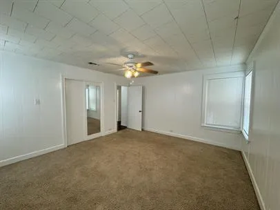 an empty room with a empty space and a window