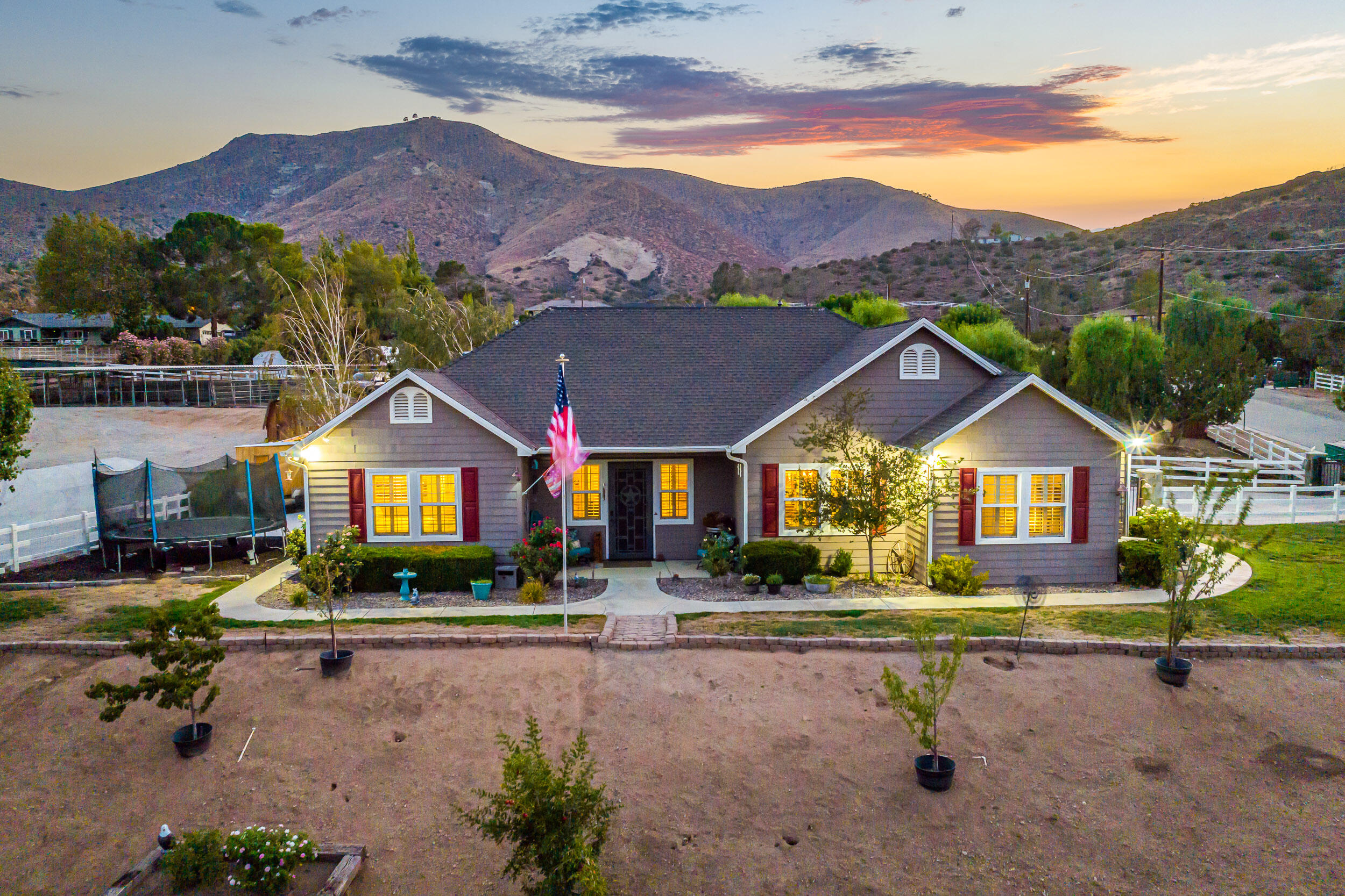 4114 9th Street Acton, CA 93510 - Photo 1 of 63 a front view of house with a yard and a car park in front of it