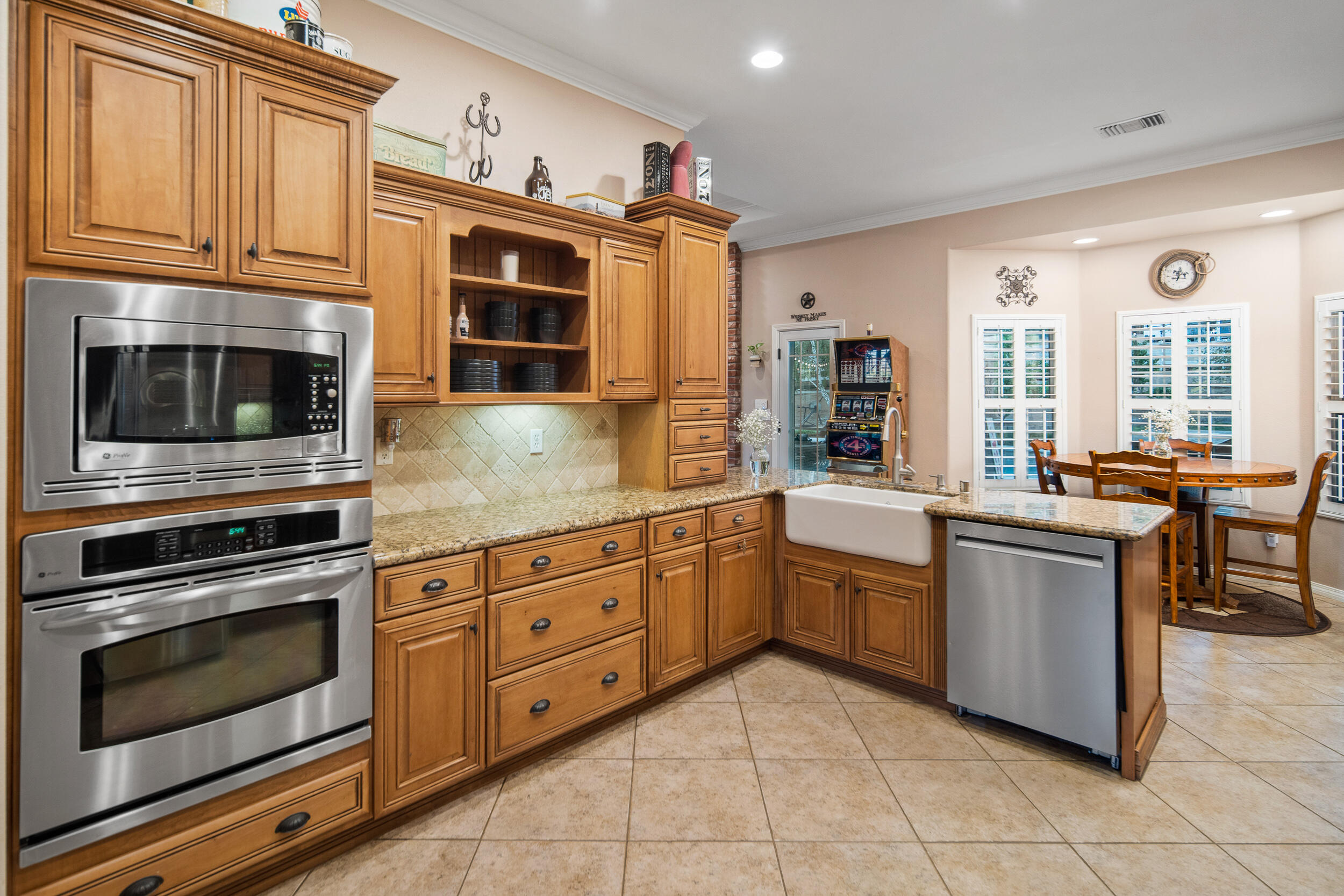 4114 9th Street Acton, CA 93510 - Photo 13 of 63 a kitchen with granite countertop cabinets stainless steel appliances and a window