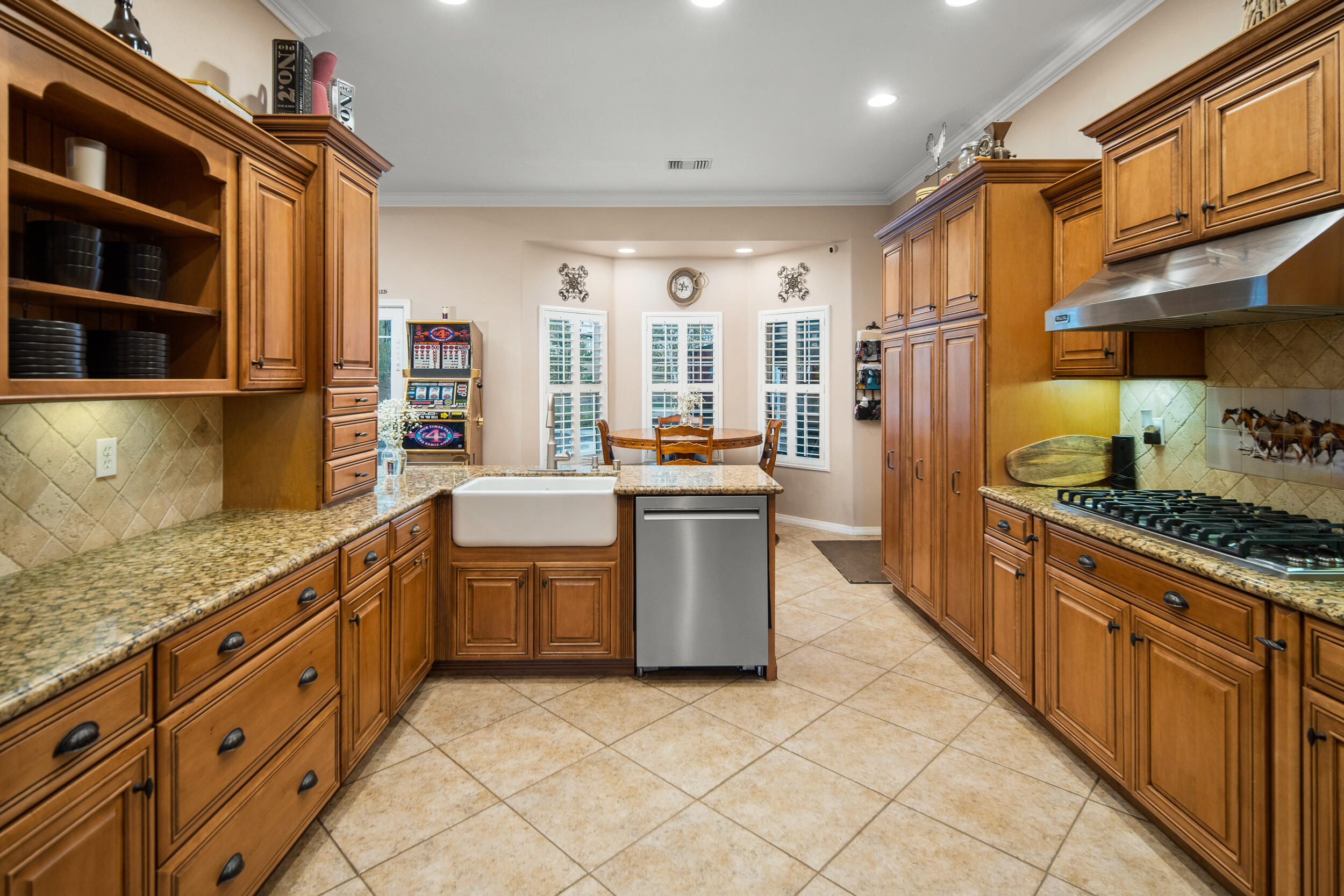 4114 9th Street Acton, CA 93510 - Photo 14 of 63 a kitchen with stainless steel appliances granite countertop a stove a sink and a refrigerator