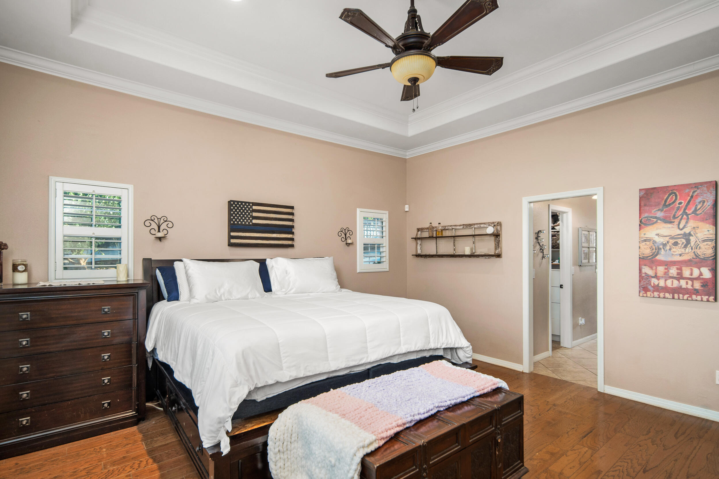 4114 9th Street Acton, CA 93510 - Photo 19 of 63 a bedroom with a bed and a chandelier