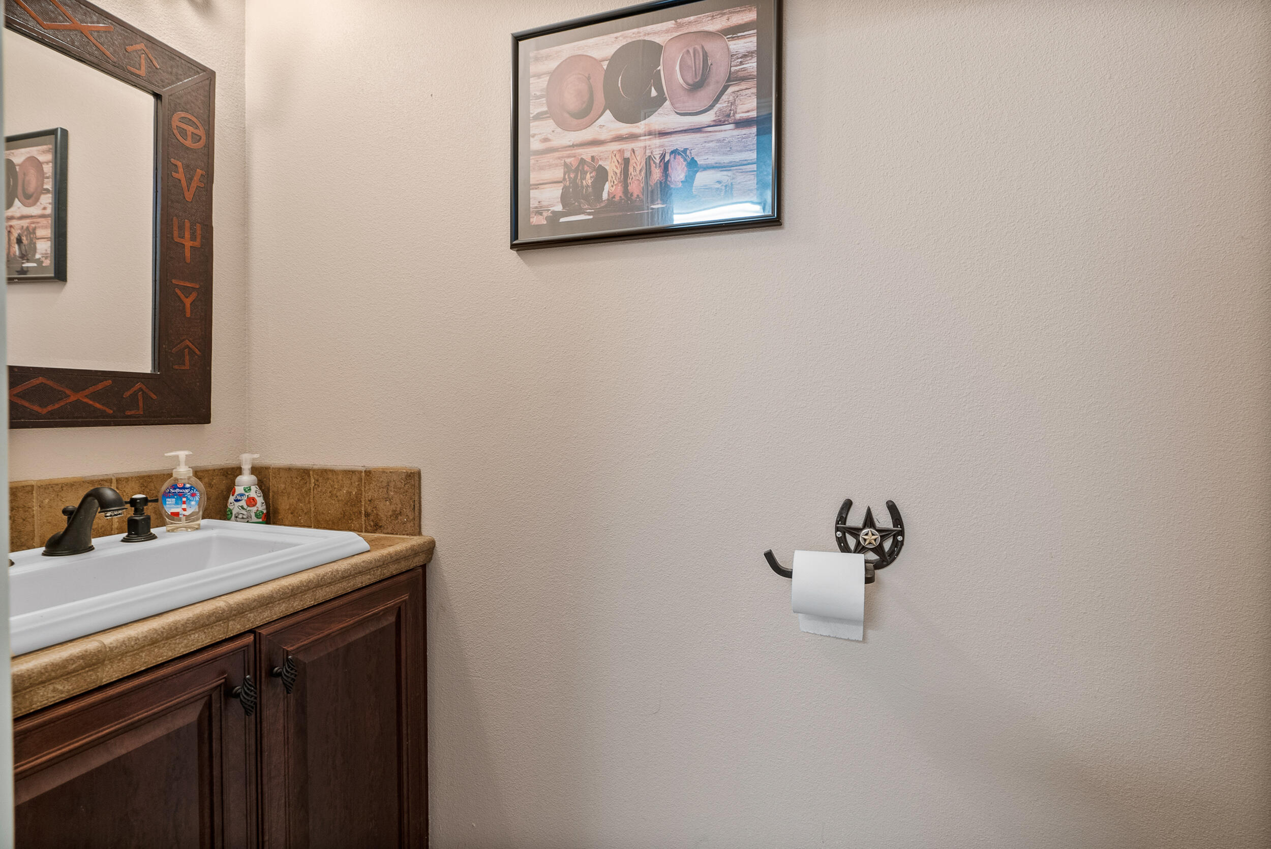 4114 9th Street Acton, CA 93510 - Photo 31 of 63 a bathroom with a sink and a mirror