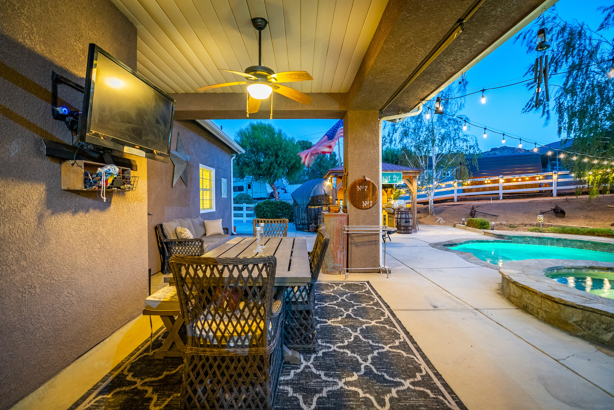 4114 9th Street Acton, CA 93510 - Photo 32 of 63 a view of a patio with dining table and chairs