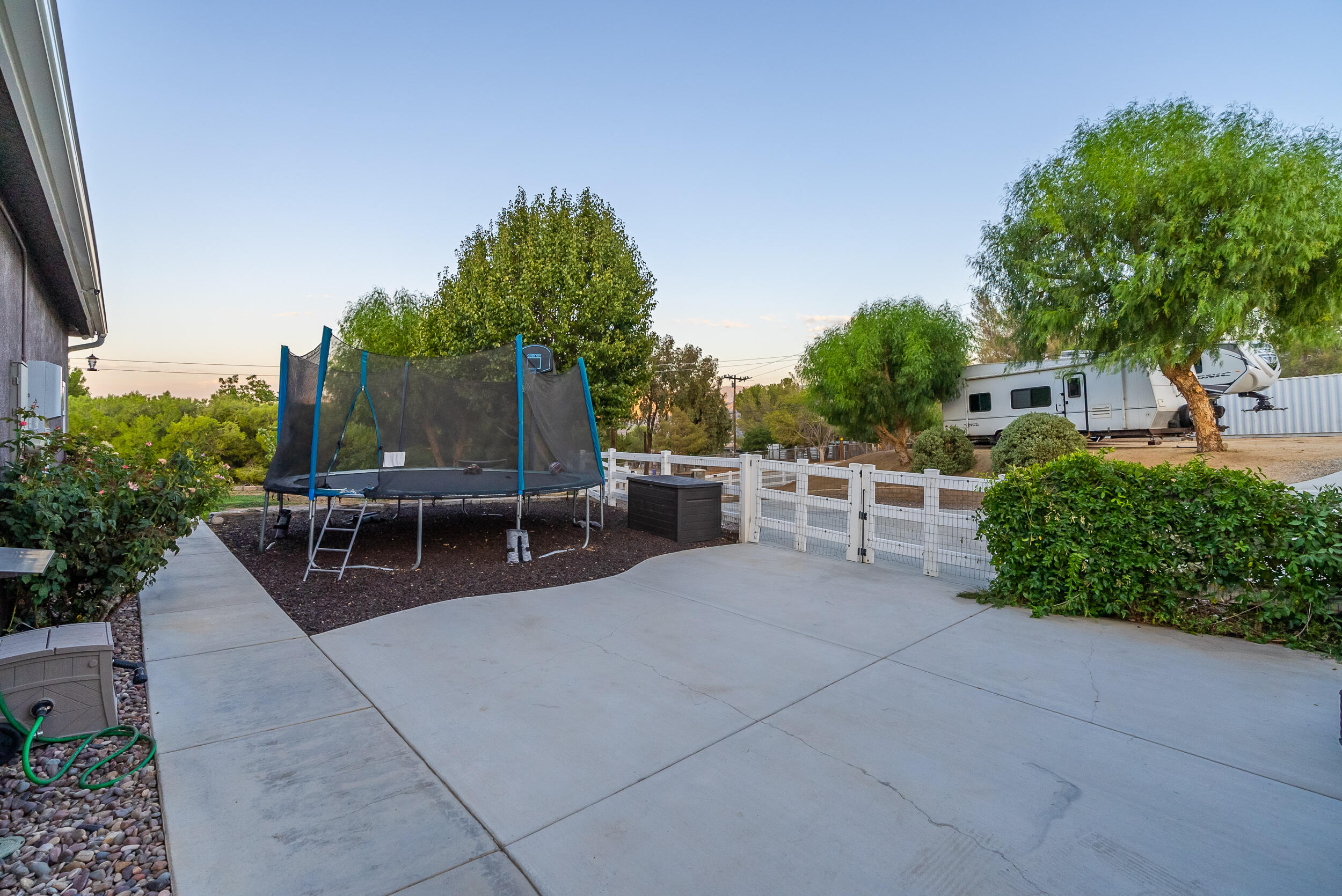 4114 9th Street Acton, CA 93510 - Photo 49 of 63 a view of a chairs and tables in the back yard of the house