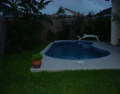 a view of swimming pool with a yard