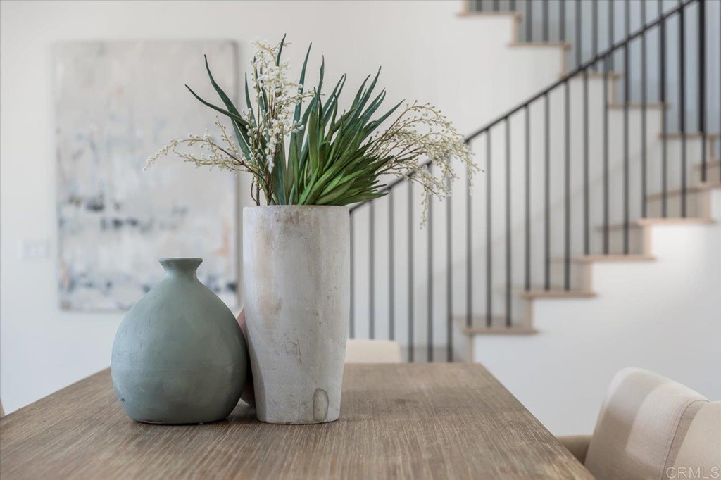 2942 Lone Jack Road Encinitas, CA 92024 - Photo 6 of 23 a vase of flowers sitting on a wooden floor