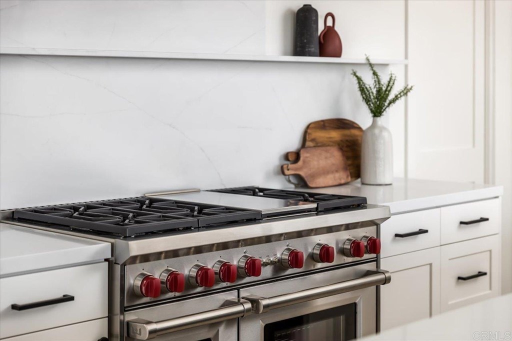 2942 Lone Jack Road Encinitas, CA 92024 - Photo 9 of 23 a close view of a stove a microwave and cabinets