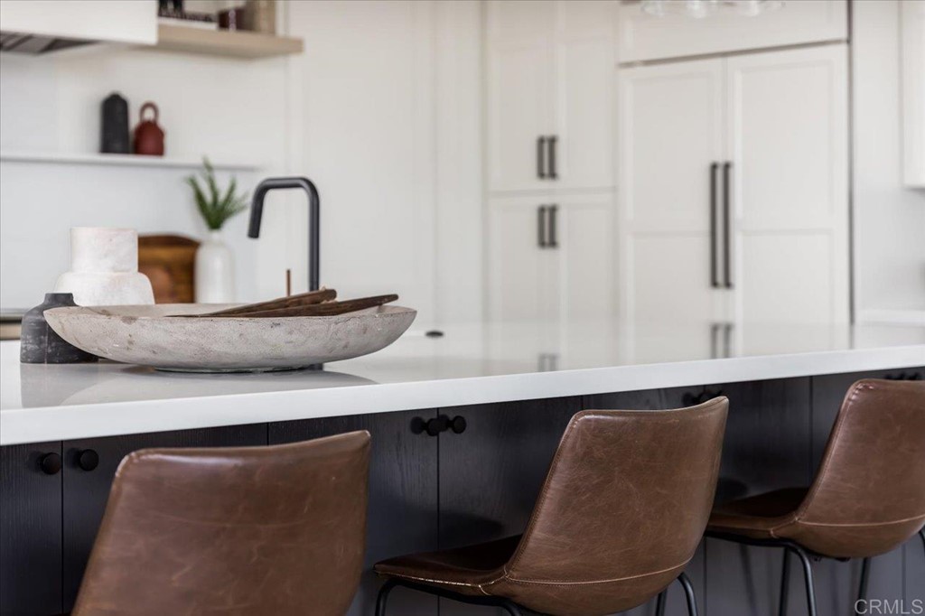 2942 Lone Jack Road Encinitas, CA 92024 - Photo 10 of 23 a kitchen with a table chairs and a refrigerator