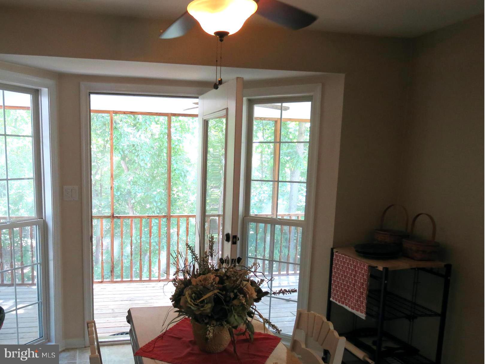 6028 Pilgrims Rest Road Broad Run, VA 20137 - Photo 20 of 29 eat in area looking out to screened porch