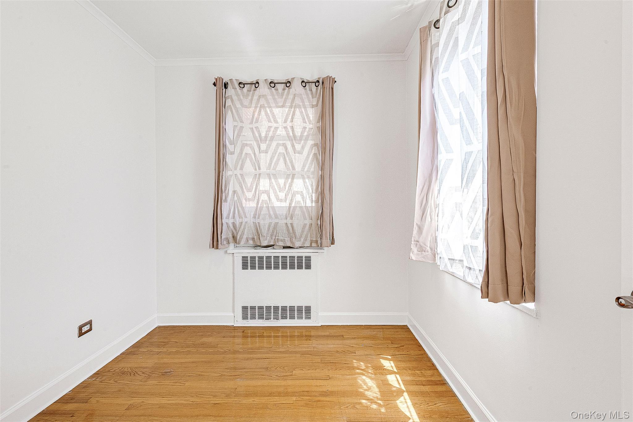 67-38 108th Street, Unit D47 Queens, NY 11375 - Photo 17 of 24 a view of an empty room and window
