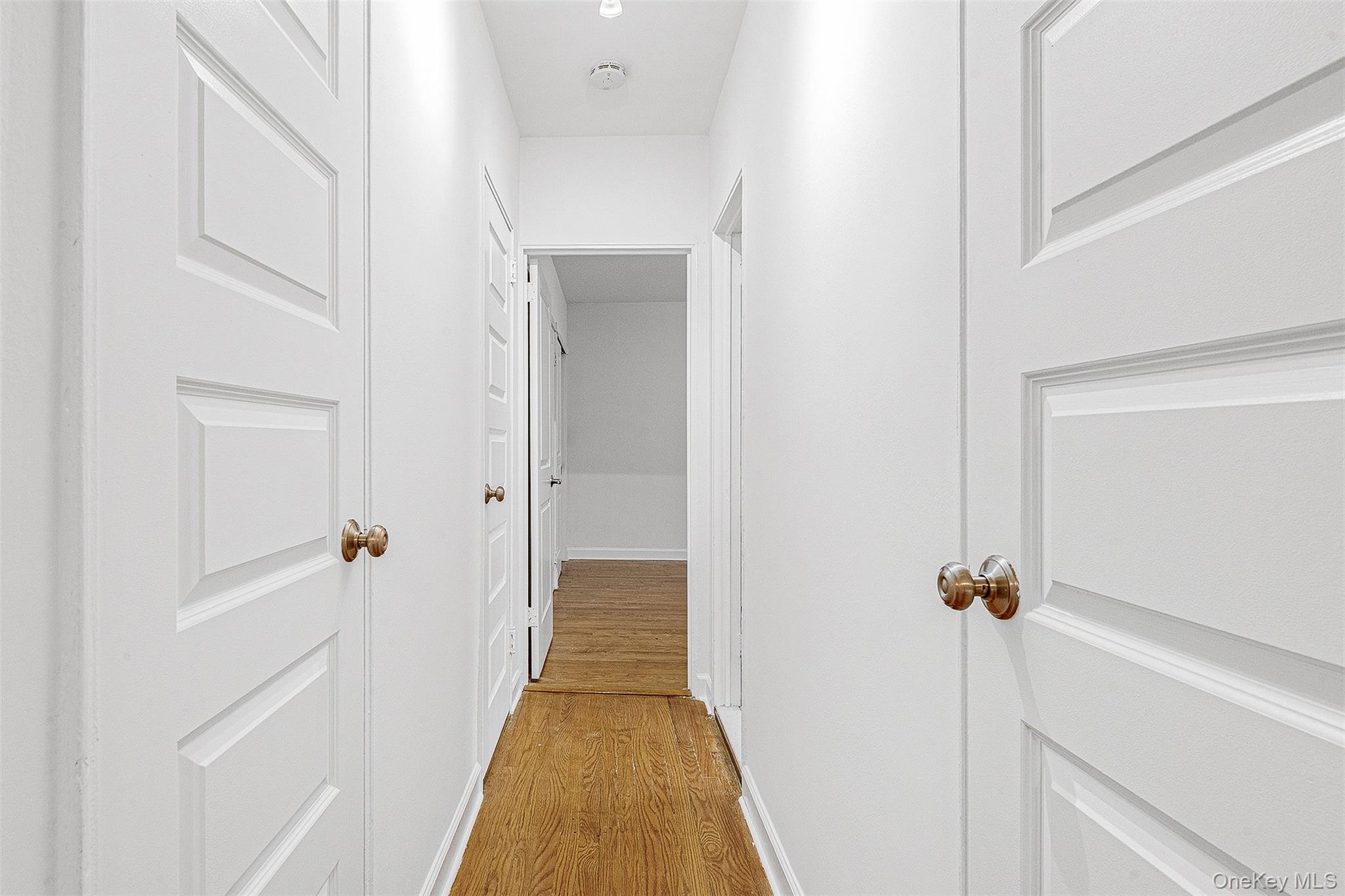 67-38 108th Street, Unit D47 Queens, NY 11375 - Photo 19 of 24 a view of a hallway with wooden floor and staircase