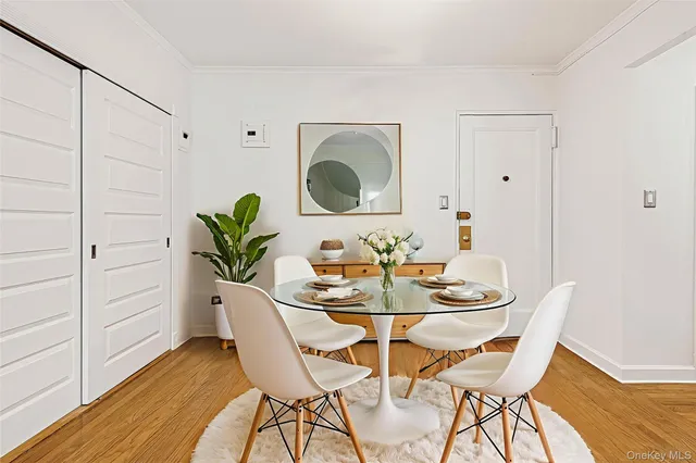 a view of a dining room with furniture and wooden floor