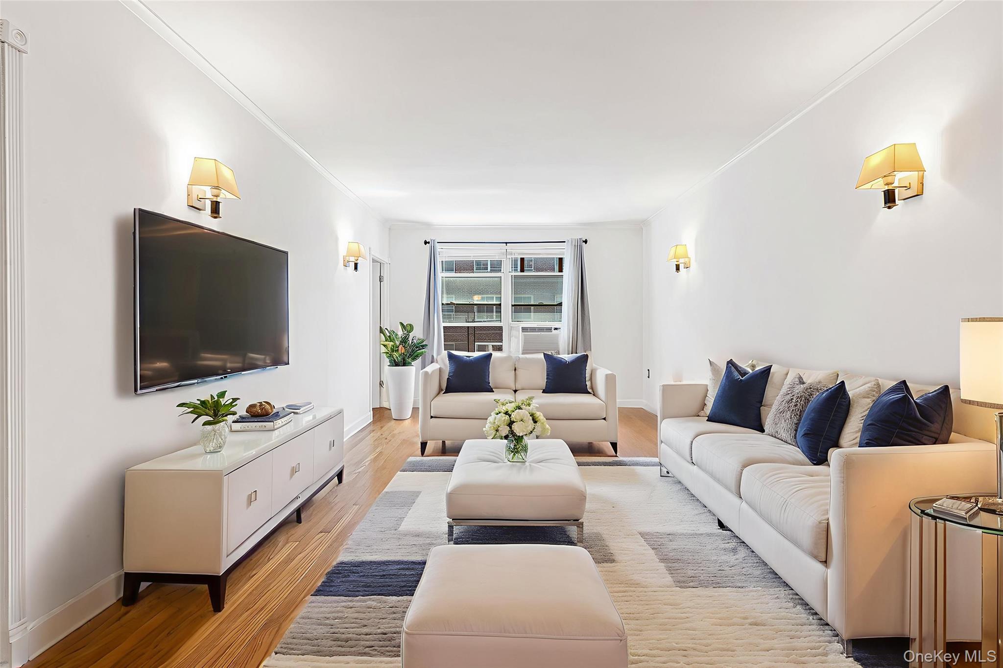 67-38 108th Street, Unit D47 Queens, NY 11375 - Photo 6 of 24 a living room with furniture and a flat screen tv