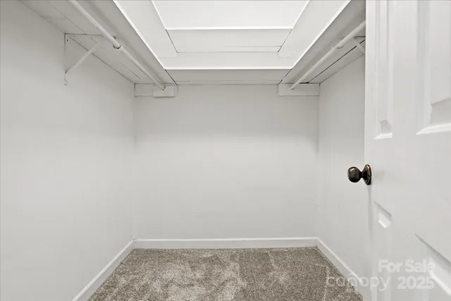 a view of a room with racks on the wall