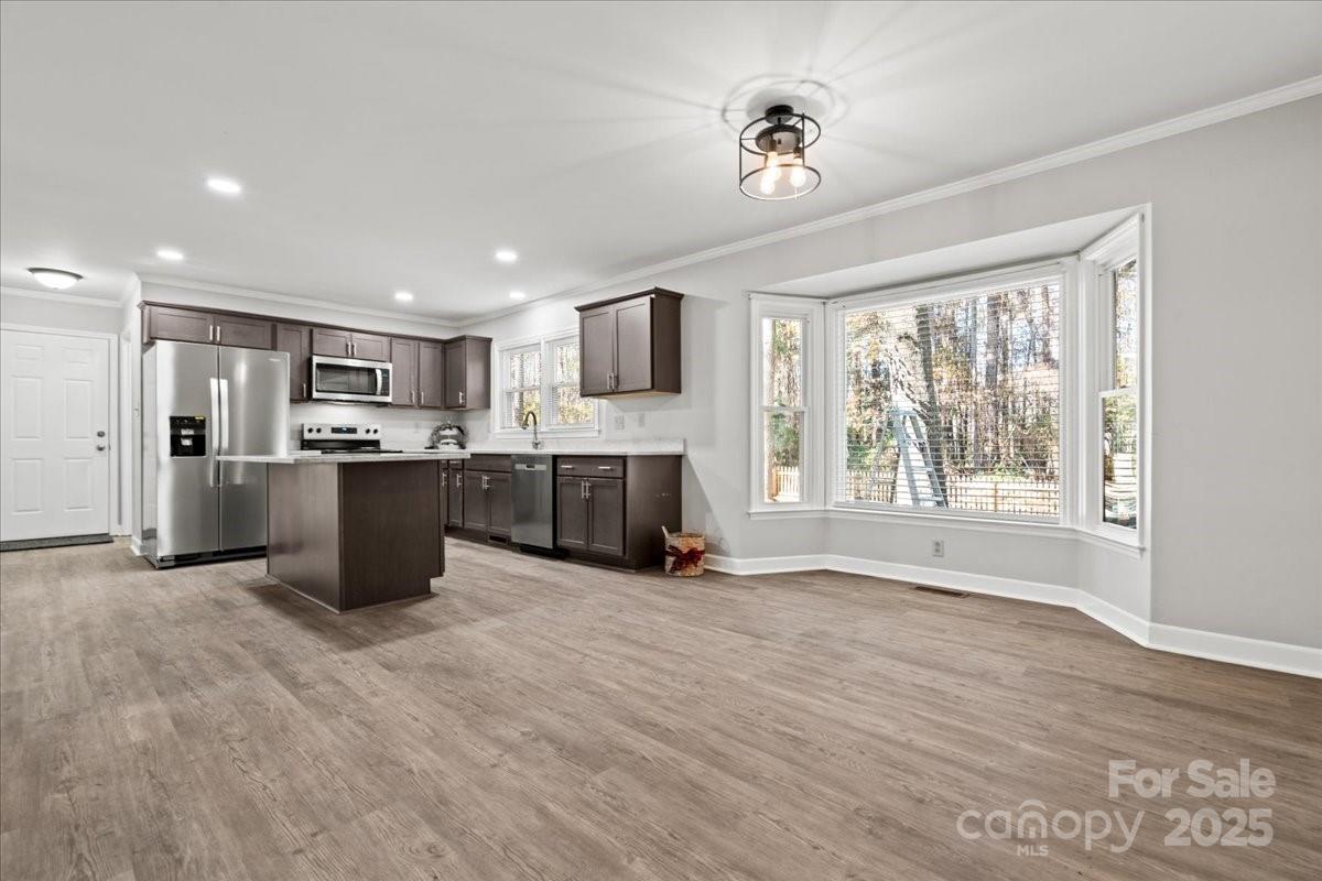 305 Virginia Avenue Cheraw, SC 29520 - Photo 14 of 48 a view of kitchen with microwave and windows