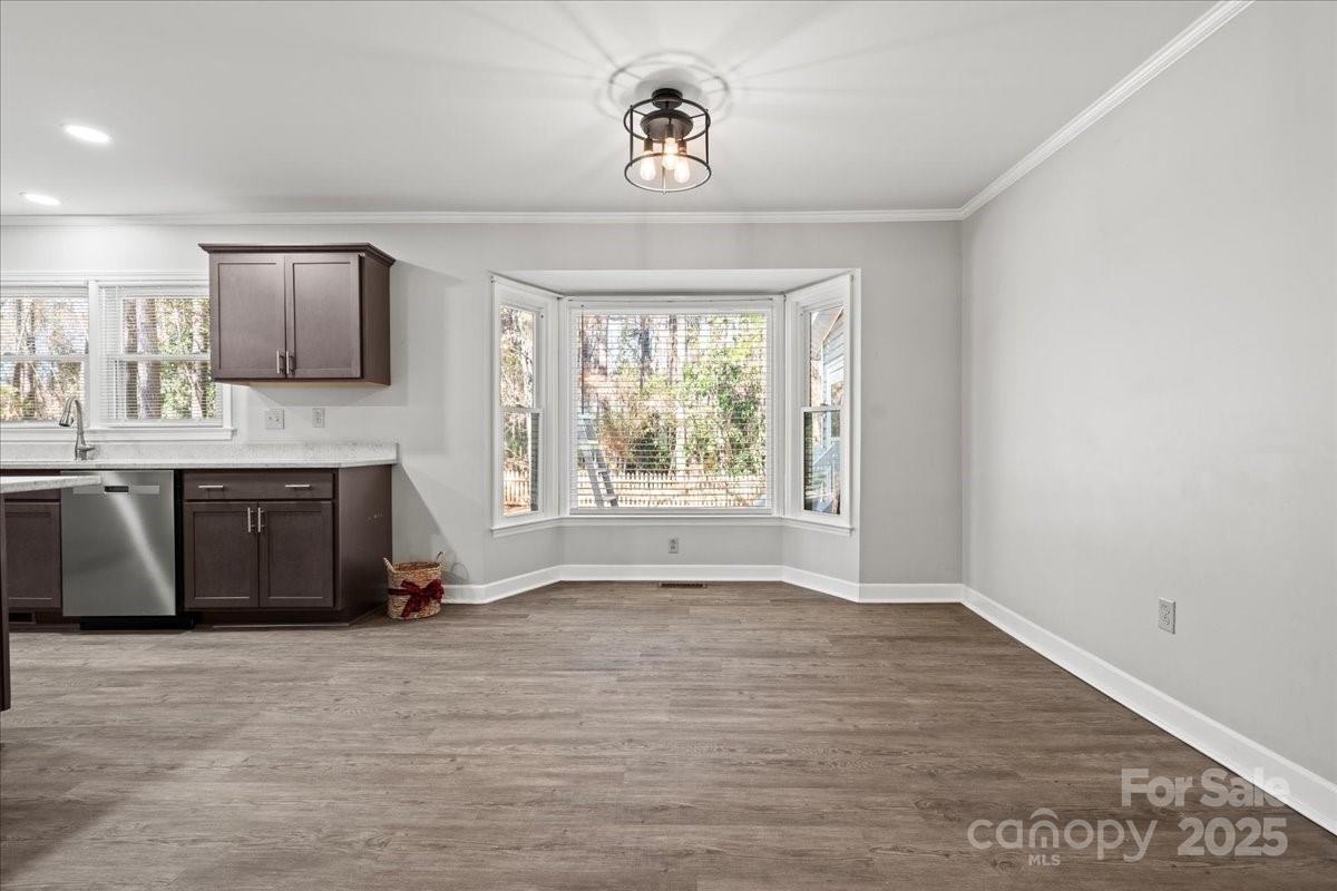 305 Virginia Avenue Cheraw, SC 29520 - Photo 18 of 48 a view of an empty room with a window and fireplace