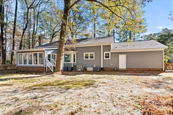 a view of a house with snow on the road