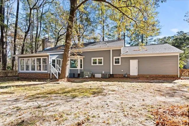 a view of a house with snow on the road