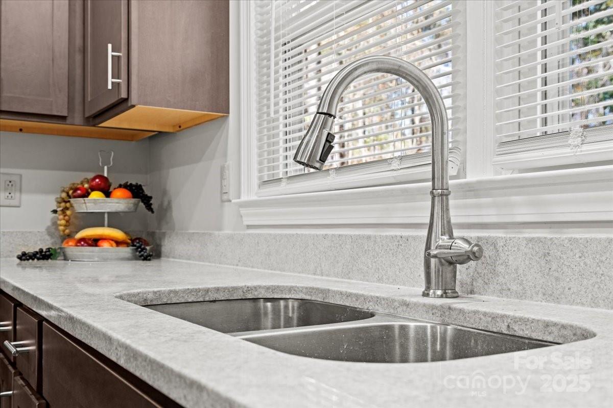 305 Virginia Avenue Cheraw, SC 29520 - Photo 21 of 48 a kitchen with a sink and a large window