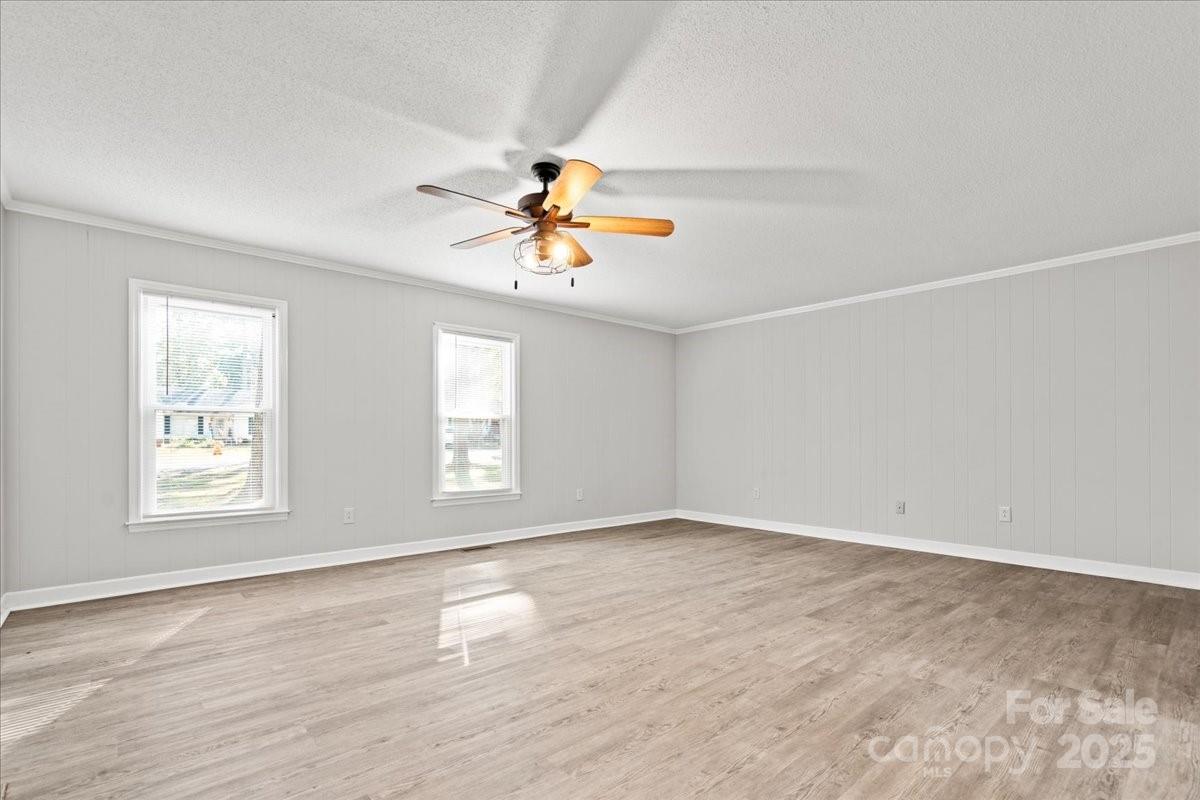 305 Virginia Avenue Cheraw, SC 29520 - Photo 22 of 48 wooden floor in an empty room with a window