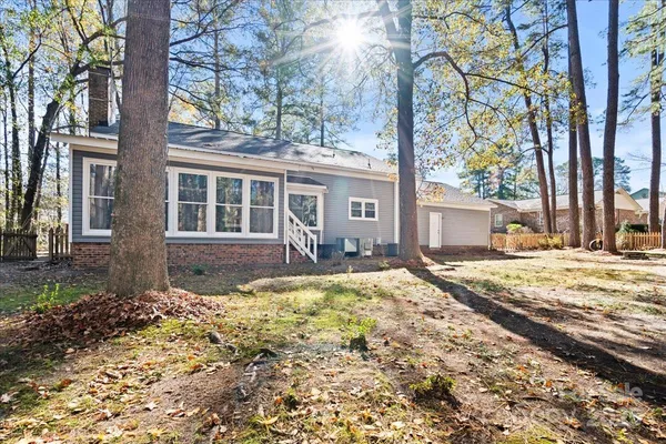 a view of a house with snow on the tree