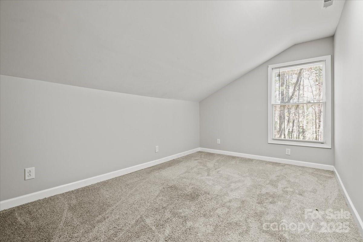 305 Virginia Avenue Cheraw, SC 29520 - Photo 32 of 48 an empty room with windows