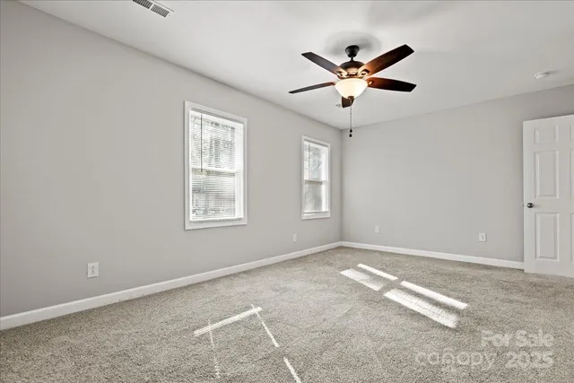 a view of workspace with window and ceiling fan
