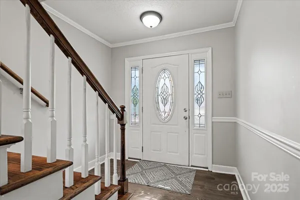a view of entryway with wooden floor